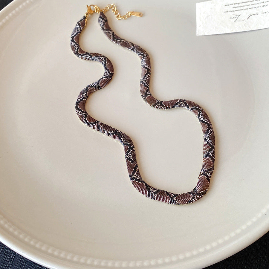 Serpentine geometric necklace